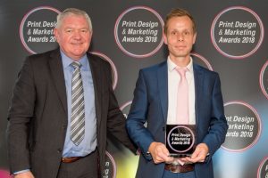 (l to r) Terry Garvey, Sales Director sponsor EFI, presents the award to MX Display's David Lister