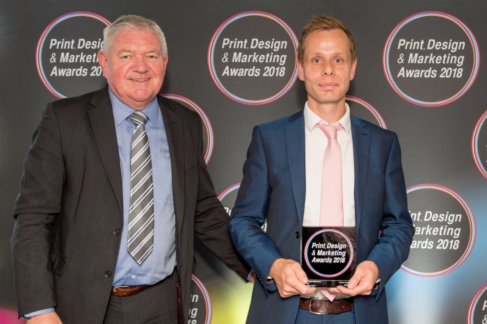 (l to r) Terry Garvey, Sales Director sponsor EFI, presents the award to MX Display's David Lister