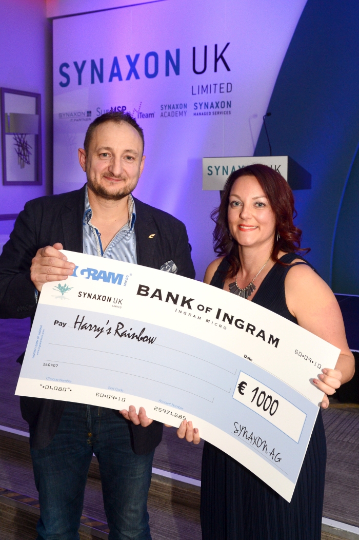 Odette Mould, CEO and Family Liason Officer at Harry's Rainbow, receiving a cheque from Mike Barron, Channel Director of Synaxon UK
